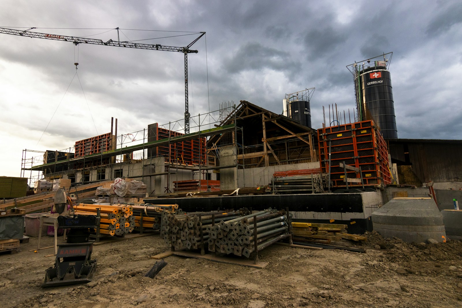 Real infrastructure construction site with crane and formwork